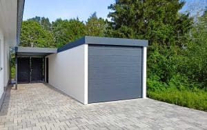 Fertiggarage mit seitlichem Carportanbau